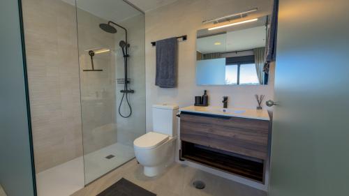 En-suite master bathroom with vanity and spacious walk-in shower
