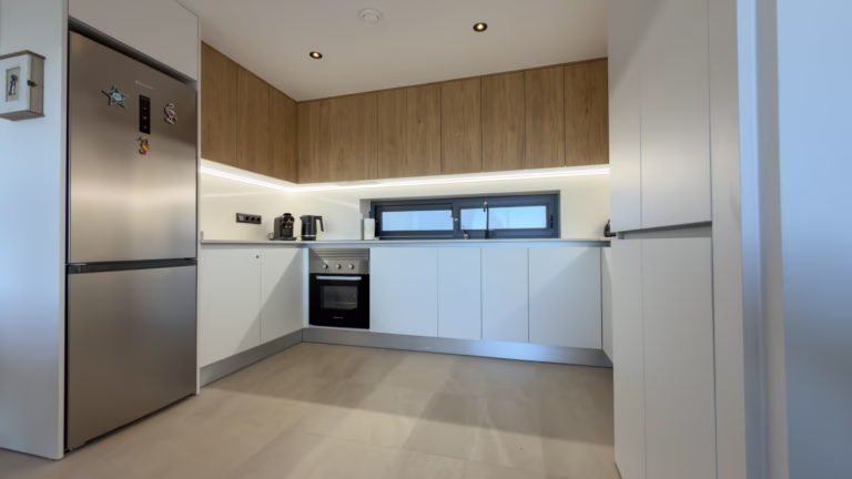 Modern kitchen with oven, hob and generous worktop space